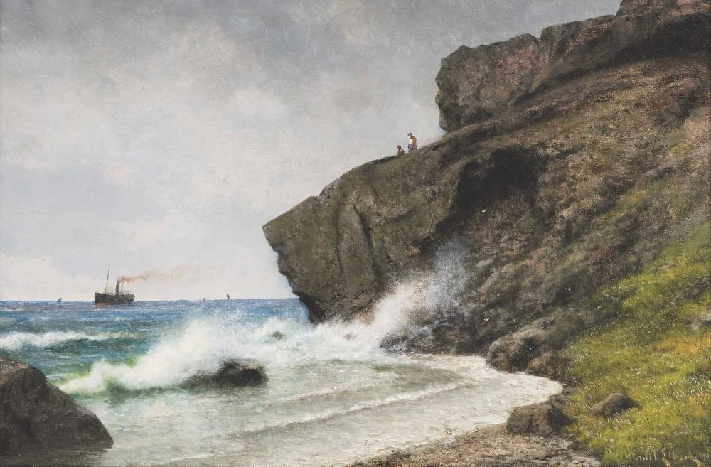 Onda che si infrange contro una costa rocciosa